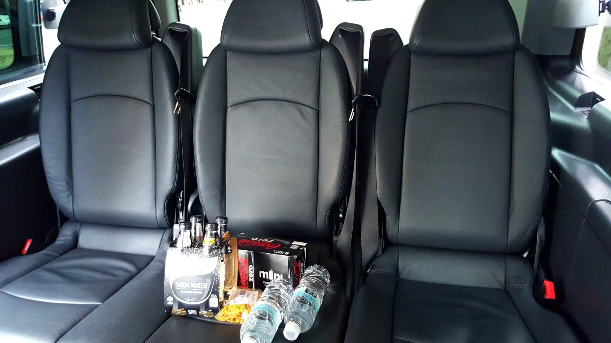 People mover back seat with beverages